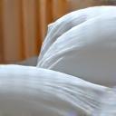 Comfortable, fluffy bed with a soft pillow