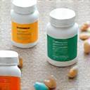 Assortment of dietary supplement bottles and capsules